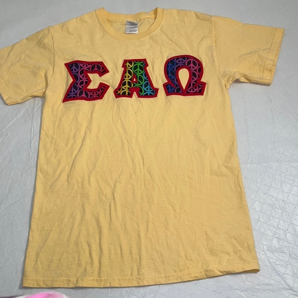 Sigma Alpha Omega multicolor peace sign sewn on letters yellow t-shirt